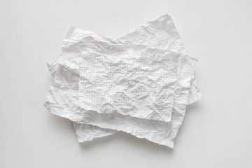 flat lay crumpled white paper sheet isolated on the table, background texture and copy spaces