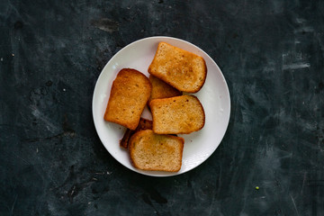 fresh hot toasted bread slices in the dark table, healthy tasty breakfasts