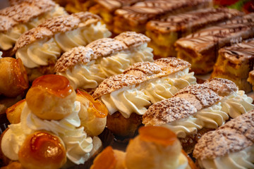Freshly baked stuffed sweet pastries Orange Lactee and Dome Citron with fruits in traditinal French...