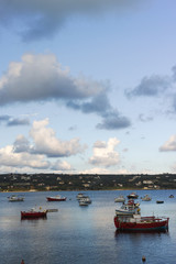 Seascape with sea harbor with clear blue water and traditional colorful greek fisher boats