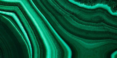 The green malachite. An ornamental stone. Photo texture. Macro.