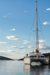 Seascape with big white catamaran yacht boat, vacation destination