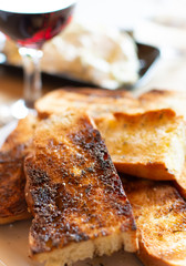 Greek food, roasted bread, red wine and tzatziki sauce made of salted strained yogurt.
