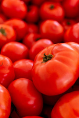 Red ripe tomatoes on farmets market close up