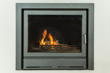 Luxurious modern design fireplace with glass door, white walls on yellow marble floor home interior