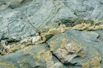 Background with green mineral rock close up, gemstone texture, olivine, amazonite, amphibolite