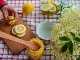 Elder flower summer drink prepapation with honey and lemon