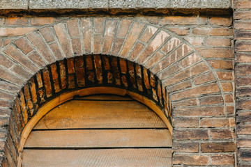 texture of old brick wall and wooden planks