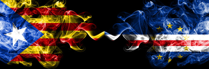 Catalonia vs Cape Verde smoke flags placed side by side. Thick colored silky smoke flags of Catalonia and Cape Verde