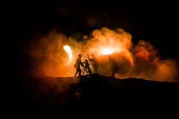Fototapeta premium War Concept. Military silhouettes fighting scene on war fog sky background,