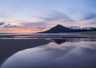 Beach of moledo at the end of the day, with a view to trega mountain on spanish side of the border. Low tide displaying the sandy beach on a cloudy day.