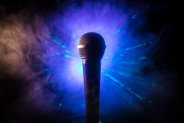 Microphone karaoke, concert . Vocal audio mic in low light with blurred background. Live music,...