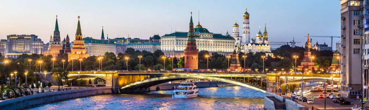 Moscow Kremlin at night, Russia. Panoramic view of city. Cityscape with Moskva River in evening.