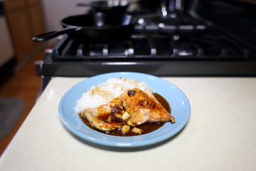 Plate of sockeye salmon with teriyaki demiglace and basmati rice.