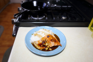 Plate of sockeye salmon with teriyaki demiglace and basmati rice.