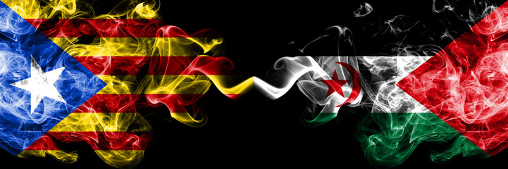 Catalonia vs Sahrawi smoke flags placed side by side. Thick colored silky smoke flags of Catalonia and Sahrawi