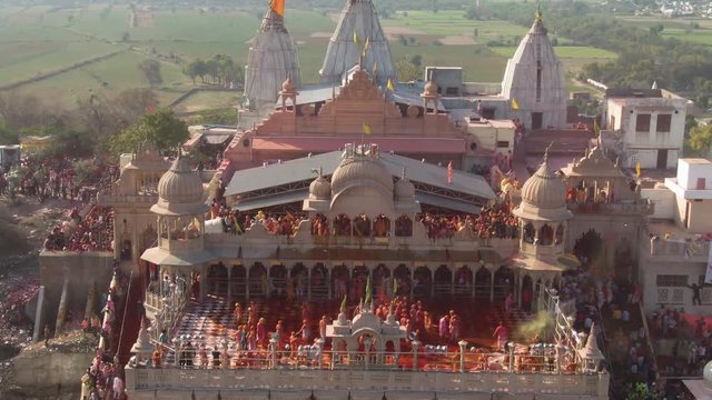Color battle at the holi festival in India, 4k aerial shot 