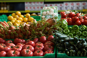 Assortment of fresh fruits and vegetables on market counter