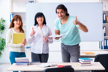 Old teacher and students in the classroom 