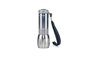 metal flashlight on white background