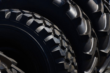 Stack of brand new tractor tires background, close-up © Gecko Studio
