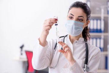 Young female doctor in infusion concept 