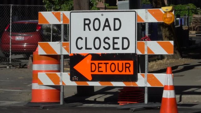 Road closed, detour sign