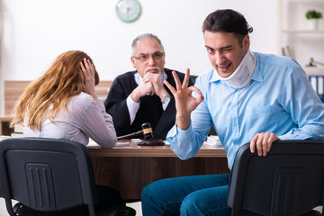 Young couple in the courthouse in divorce concept  