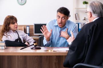 Young couple in the courthouse in divorce concept  