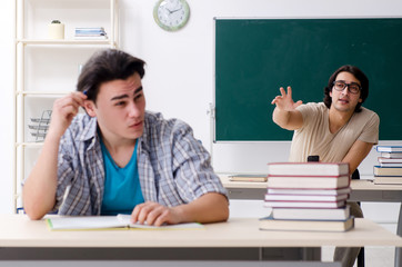 Two male students in the classroom 