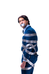 Tied employee with tape on mouth isolated on white 