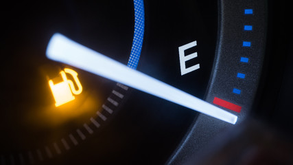 Empty fuel warning light in car dashboard