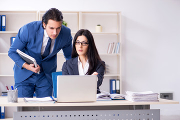 Fototapeta premium Two employees working in the office 