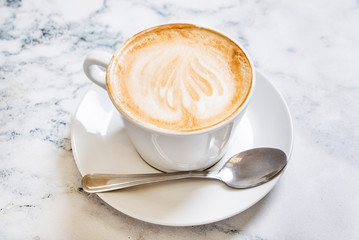 cup of cappuccino on the marble background