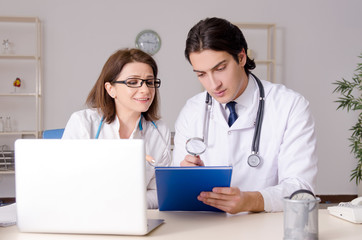 Two doctors working in the clinic 