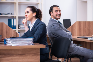 Two employees working in the office 