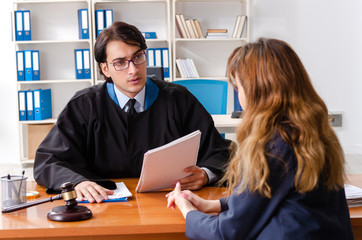 Young woman visiting male lawyer 