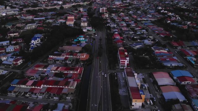 Aerial Footage of residential housing at Kota Kinabalu city with car moving on the road, Kota Kinabalu, Sabah, Malaysia