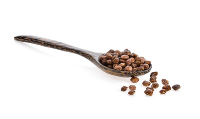 Obraz premium Nuts seed in wood spoon on white background