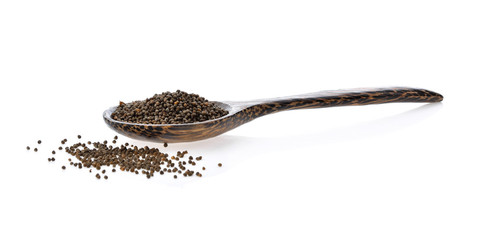 sesame seed in wood spoon isolated on white background