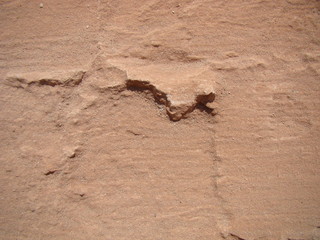 Abstract background - red earth and sand. Rocky elevations. View from top. The concept of the surface of the planet Mars.