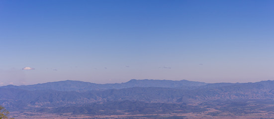 Summer of Thailand with landscape mountains and blue sky natural background.