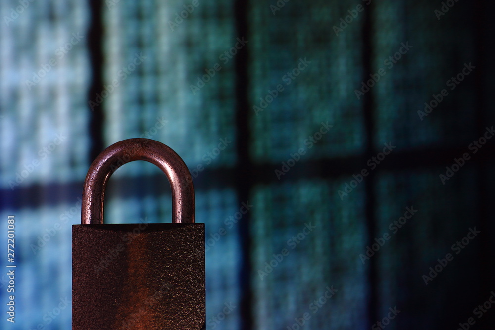 Poster padlock closed. padlock placed in front of circular defocus bokeh light. digital computer and intern