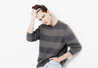 Attractive teenage boy posing in studio