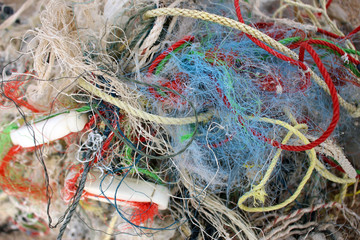 Abstract background of details of tangled fishing nets and ropes.
