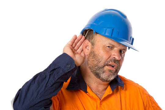 An Industrial Worker With Hearing Loss Trying To Listen.