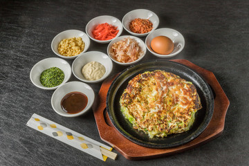 お好み焼き  Okonomiyaki is a Japanese-style pancake