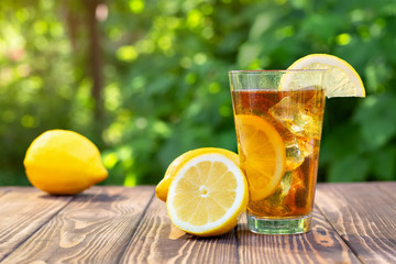 glass of ice tea on wooden table