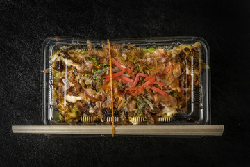 お好み焼き  Okonomiyaki is a Japanese-style pancake