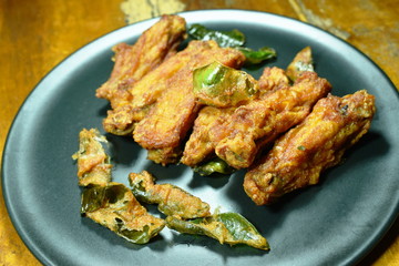 crispy fried chicken wing with lemon grass on plate